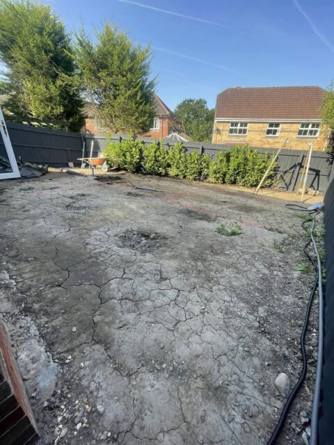 imprinted concrete and artificial grass back garden